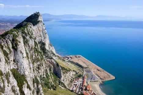 Gibraltar Rock steep cliff by the Mediterranean Sea in southern part of Iberian Peninsula.