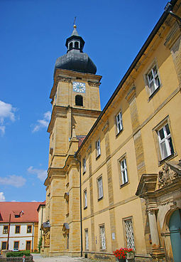 Wolfgang Dientzenhofer se také stává architektem. K jeho pracím patří i klášterní kostel v Ensdorfu.