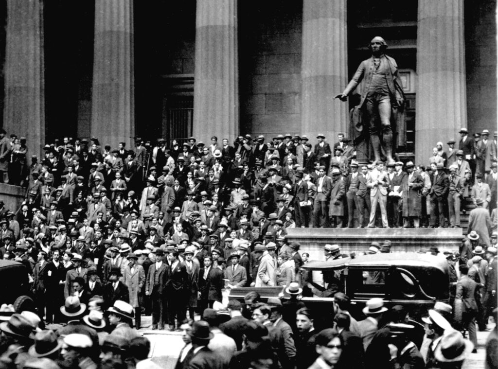 People gather on the sub-treasury building steps across from the New York Stock Exchange in New York on "Black Thursday," Oct. 24, 1929. Thousands of investors lost their savings in the worst stock market crash in Wall Street history on Oct. 29, 1929, after a five-day frenzy of heavy trading. Too much speculation with borrowed money had inflated market values unrealistically. Huge buying orders, hastily erected by powerful financial interest, finally checked the most frantic sell-off experienced by the securities markets. The Great Depression followed thereafter. (AP Photo)