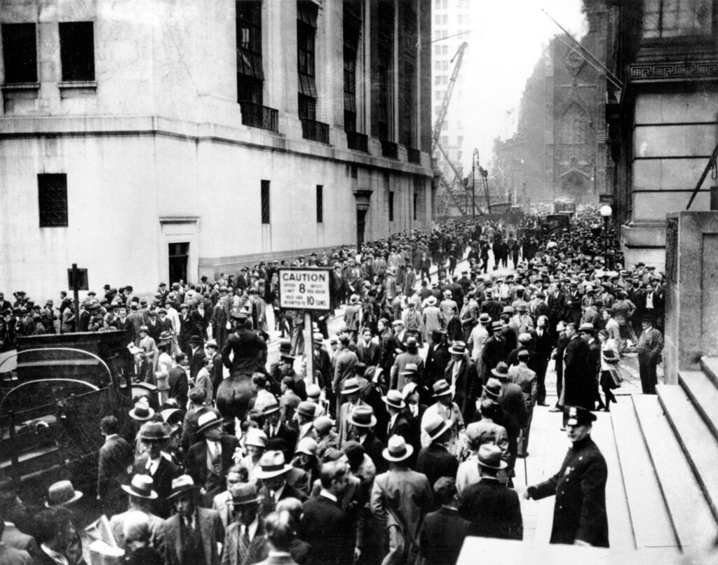 Crowds panic in the Wall Street district of Manhattan due to the heavy trading on the stock market in New York City on Oct. 24, 1929. (AP Photo)
